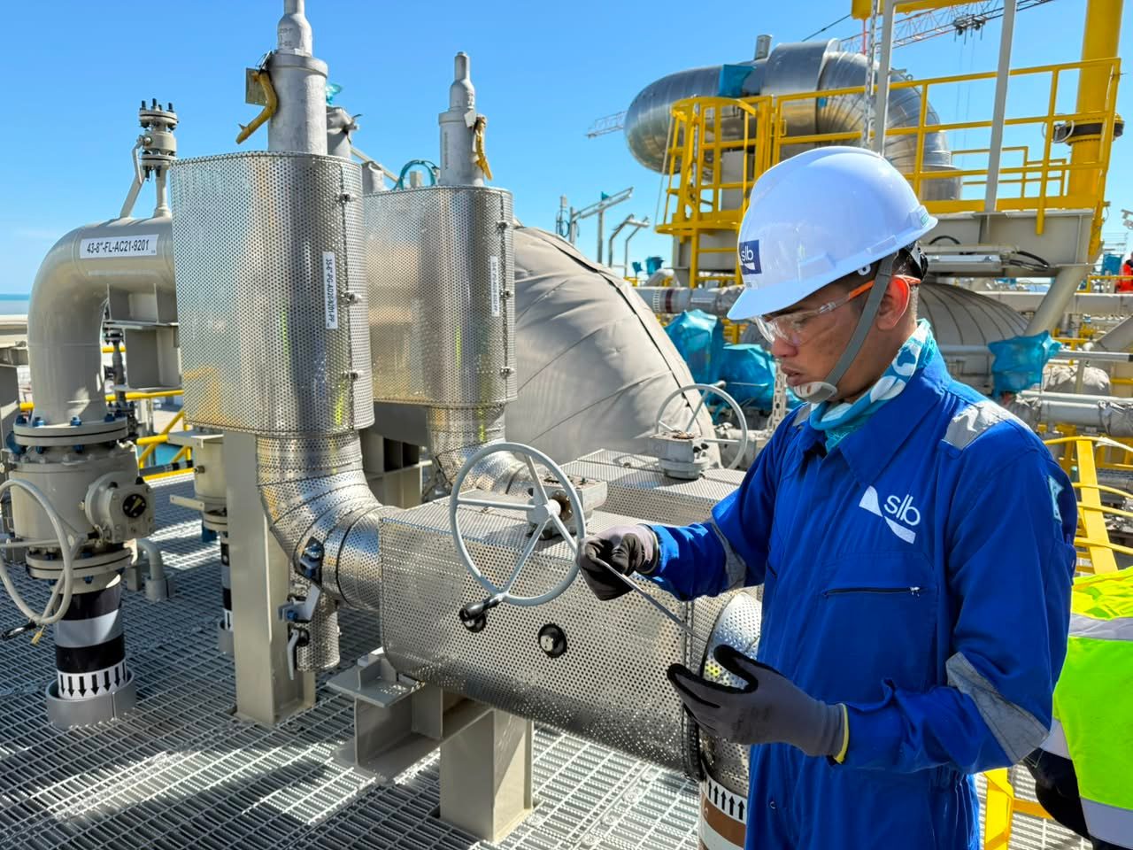 Mechanical inspection technician working on valve assembly